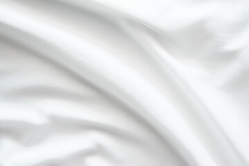 Fototapeta premium The texture of the bright white fabric is wavy and flowing, the wrinkles of the white stretch fabric.