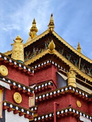 Naklejka premium Songzanlin Monastery in Shangri-La County, also called Ganden Sumtseling Monastery or Guihua Monastery, is the largest Tibetan Buddhist temple complex in Yunnan Province, China