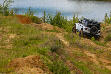 Off-road vehicle in difficult terrain, off-road car rally, off-road car group races © dominikspalek.pl