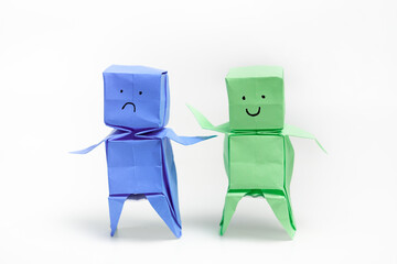 Two Origami Figures Expressing Contrasting Emotions in Minimalist Style