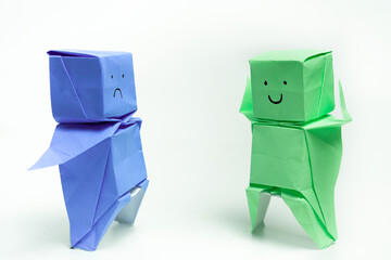 Two Origami Figures Expressing Contrasting Emotions in Minimalist Style