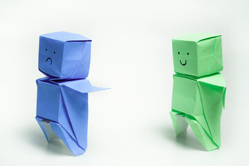 Two Origami Figures Expressing Contrasting Emotions in Minimalist Style