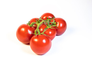 Six fresh vine-ripened tomatoes on a white background, showcasing their vibrant red colour and green stems—perfect for cooking, salads, or healthy eating themes.