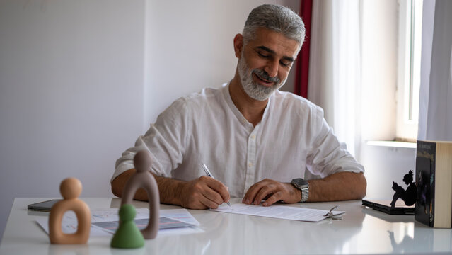 businessman signing agreement in office