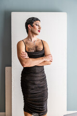 Dynamic Drag Queen Portrait Showcasing Confidence and Artistry Against a Minimalist Backdrop