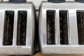 A top view of a stainless steel toaster showing its many slots,  toaster stainless steel appliance.