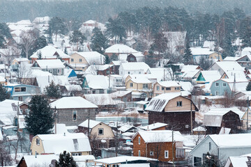 Nestled in a quiet area, the village is draped in soft white snow, transforming each house into a picturesque winter