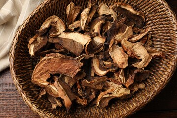 Dried chanterelle mushrooms on wooden table, top view