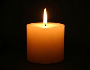 Single candle flame in darkness