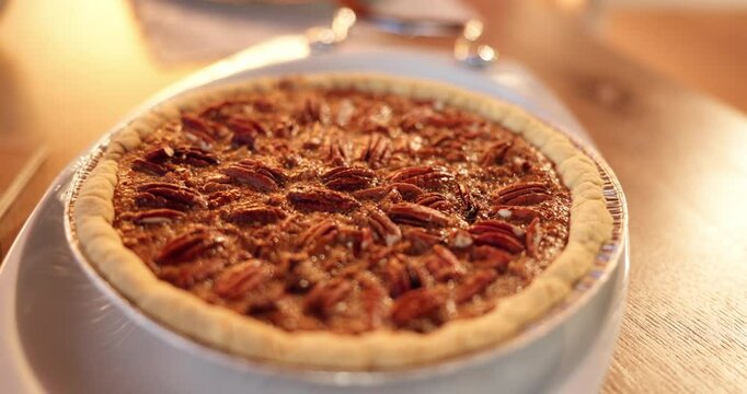 Christmas, holidays and tradition with tart on table in home for baking or dessert from above. Cake, food or pecan pie in dining room of apartment for festive celebration, hunger and winter season