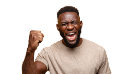 Portrait of an excited man celebrating with a raised fist, isolated on white background.