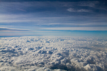 beautiful thick clouds in the sky from the height of the plane