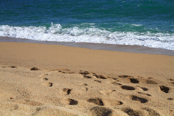 beautiful landscape on the coast of the beach and sea waves against the background of the blue sky