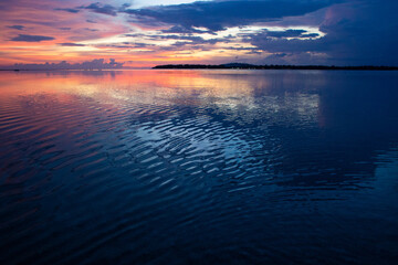 beautiful dramatic landscape of sunset on the sea beach