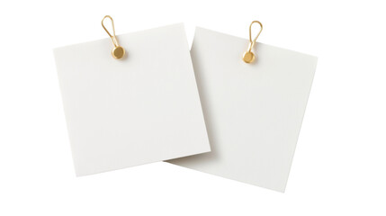 white note pinned with a gold pin on white background