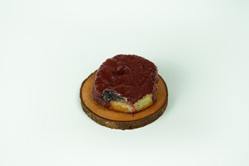 taking single donut in white studio background