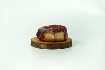taking single donut in white studio background