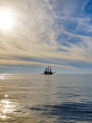 a beautiful ship is sailing in the blue sea