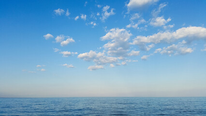 beautiful landscape on the coast of the beach and sea waves against the background of the blue sky