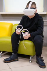 a child in virtual reality glasses plays a game