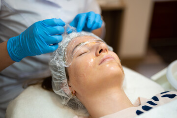 close-up of a girl's face at a cosmetologist during treatment procedures