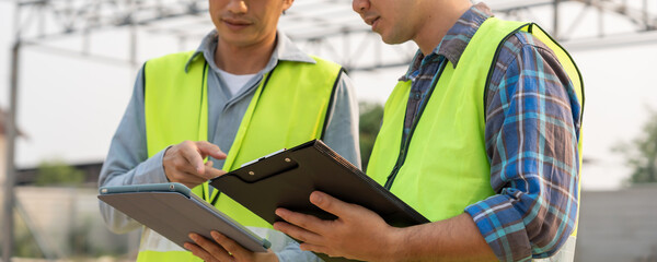 Engineers team discuss check and review the blueprint of construction. Contractor inspection...