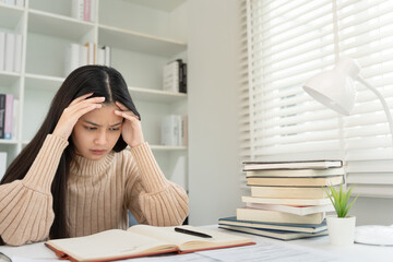 Asian student woman have anxiety because of exams, female prepare for test and learning lessons in...