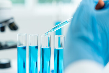 Scientist analyze biochemical samples in advanced scientific laboratory. Medical professional use...