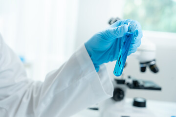 Scientist analyze biochemical sample in advanced scientific laboratory. Medical professional check...