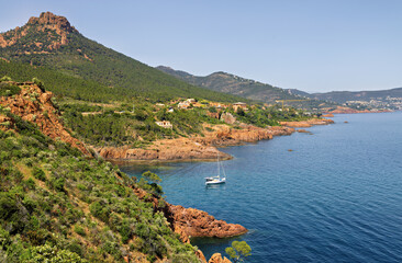 Steep coast on the Cote d'Azur, French Riviera, overlooking the open Mediterranean Sea with ships