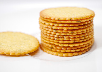 Thin round biscuits crackers stacked together close-up, Sweet and tasty round butter crackers.