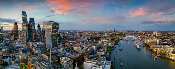 Panoramic aerial view of the London cityscape from the City skyscrapers to Tower Bridge and Thames...
