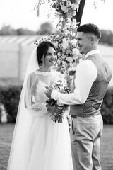 wedding ceremony of a young couple in love on a green meadow