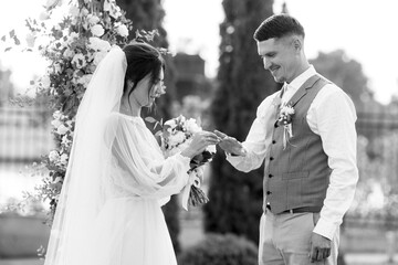 wedding ceremony of a young couple in love on a green meadow
