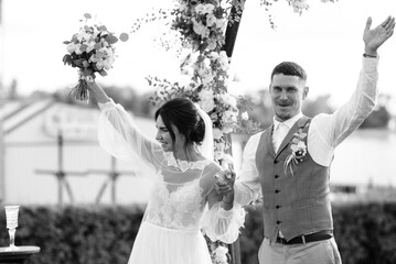 wedding ceremony of a young couple in love on a green meadow