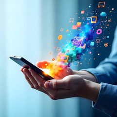 Hand holding smartphone with glowing apps high resolution photo