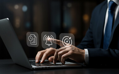 Businessman interacting with digital interface icons on a laptop