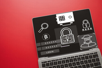 Cybersecurity dashboard on laptop screen with icons for hacker, password, and biometric fingerprint...