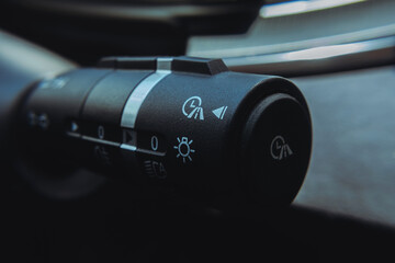 Close-up view of an electric vehicle's center console, showcasing the control panel, which...