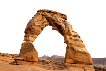 Famous red sandstone natural arch formation in desert landscape with distant mesas under clear blue sky, isolated on a transparent background