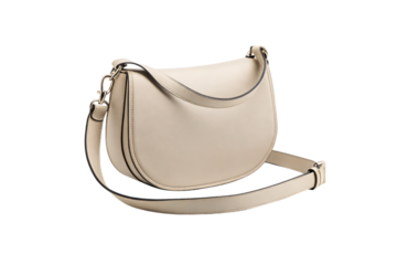 Beige leather crescent-shaped handbag with shoulder strap, metal hardware, and minimalist contemporary design aesthetic, isolated on a transparent background