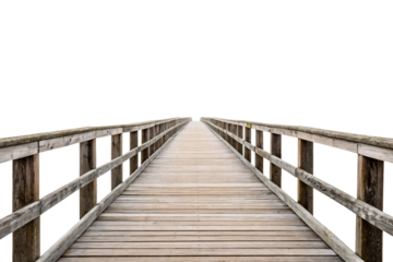 Weathered wooden boardwalk with railings extending into misty white background creating vanishing point perspective, isolated on a transparent background