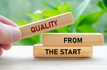 Quality From the start text on wooden blocks in hand shows a strong foundation laid from day one