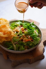 salad with peanut sauce named asinan Betawi in Bahasa 