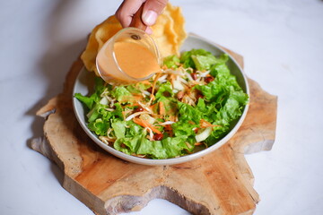 salad with peanut sauce named asinan Betawi in Bahasa 