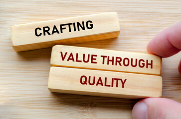 Crafting value through quality text on wooden blocks represents the foundation of excellence and...