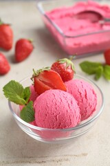 Tasty sorbet with strawberries and mint served on light table, closeup