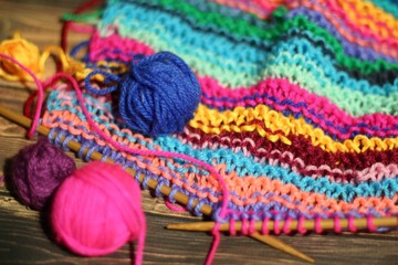 Needlework knitting needles and clews yarn balls cozy multicolor photo 