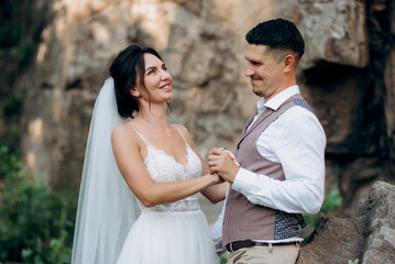 bride blonde girl and groom near the river