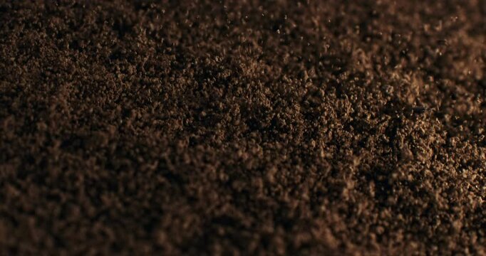 Close-Up of Fresh Ground Coffee in Slow Motion Aromatic Brown Granules, Rich Texture, and Bold Roast Perfect for Morning Rituals, Espresso Shots, and Caffeine-Lovers' Visual Inspiration at 1000 fps